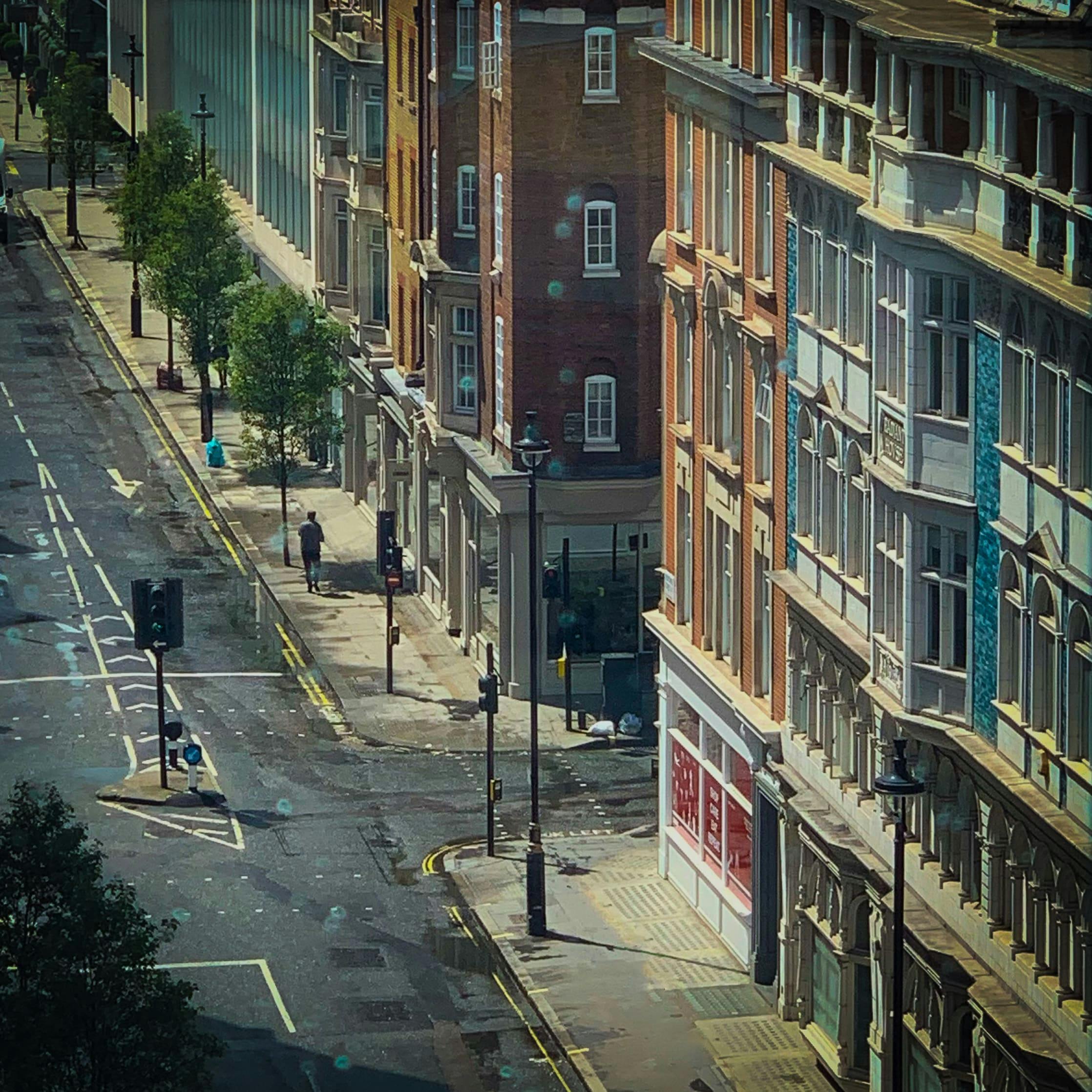A photograph looking down at Mortimer Street, Fitzrovia, taken on a sunny afternoon, whilst the streets were quiet. 