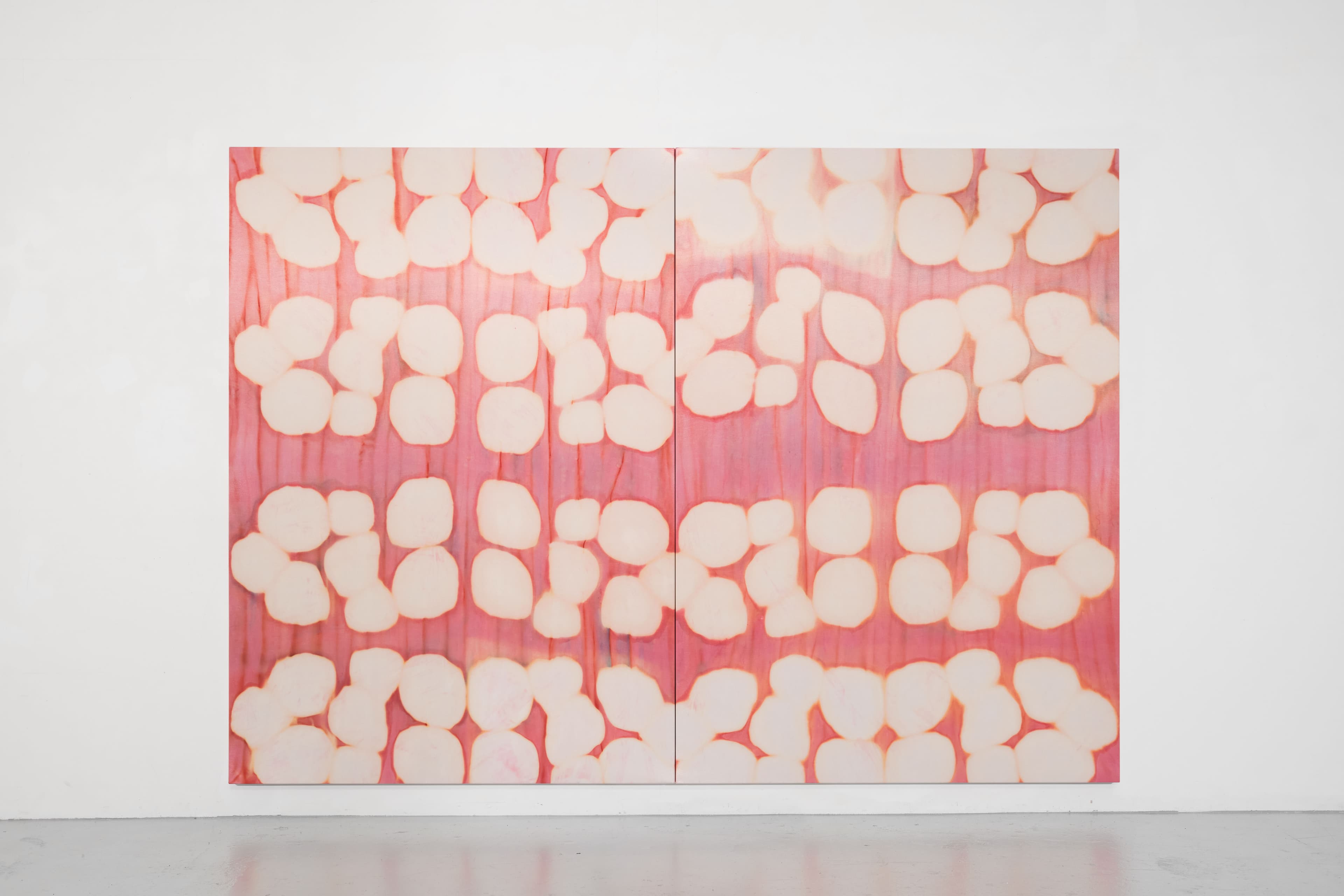 A large diptych painting by Max Boyla. Circular white forms on a pink background.