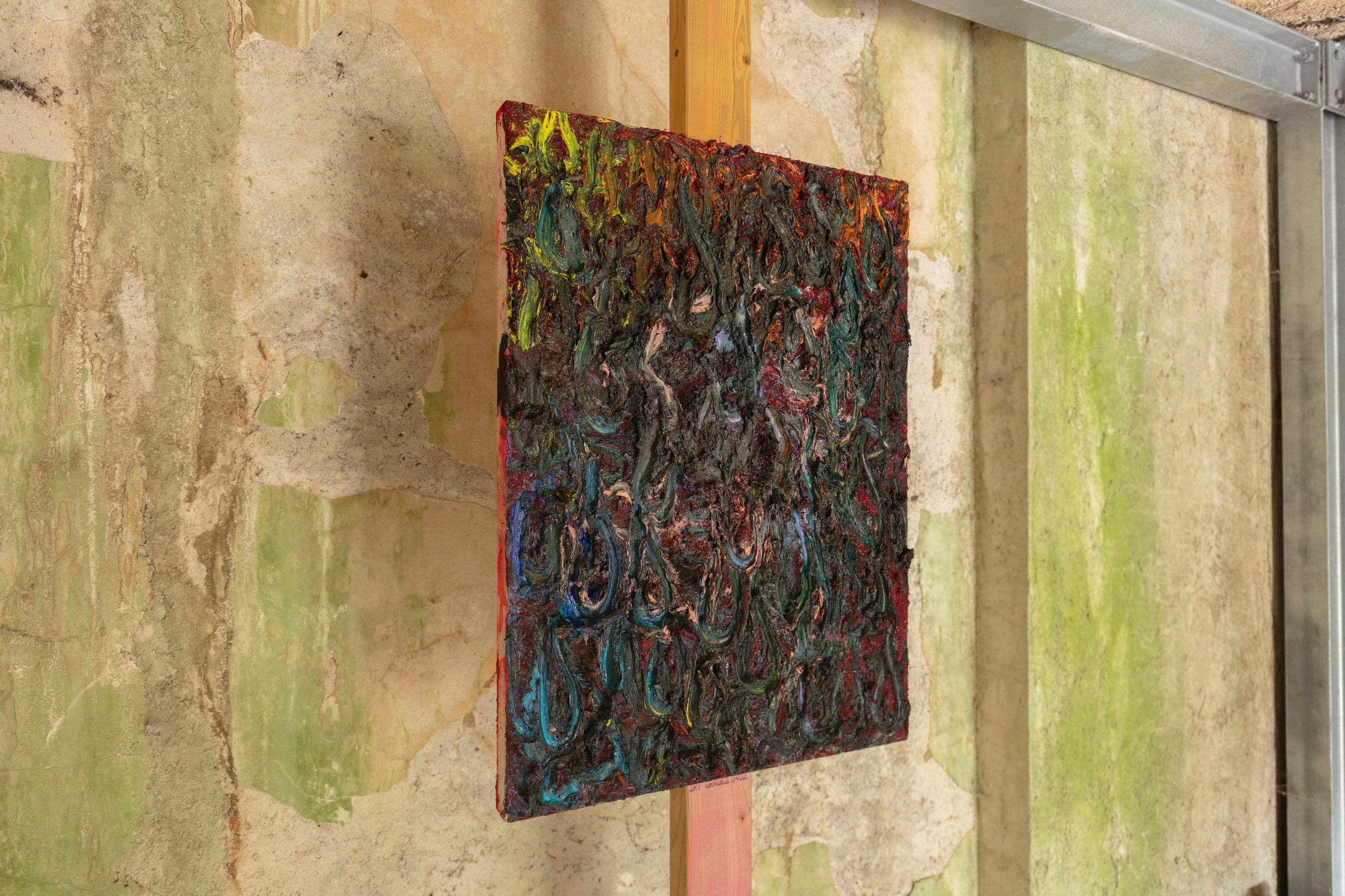 Artworks by James Cabaniuk installed outside in a lush green garden