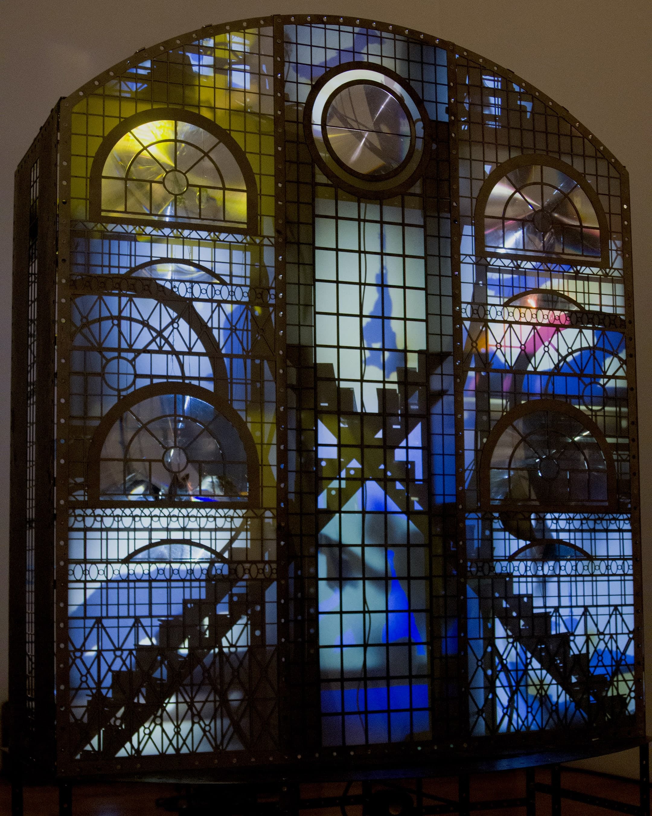 A a kinetic sculpture by Hazel Brill comprised of steel, glass and lights.