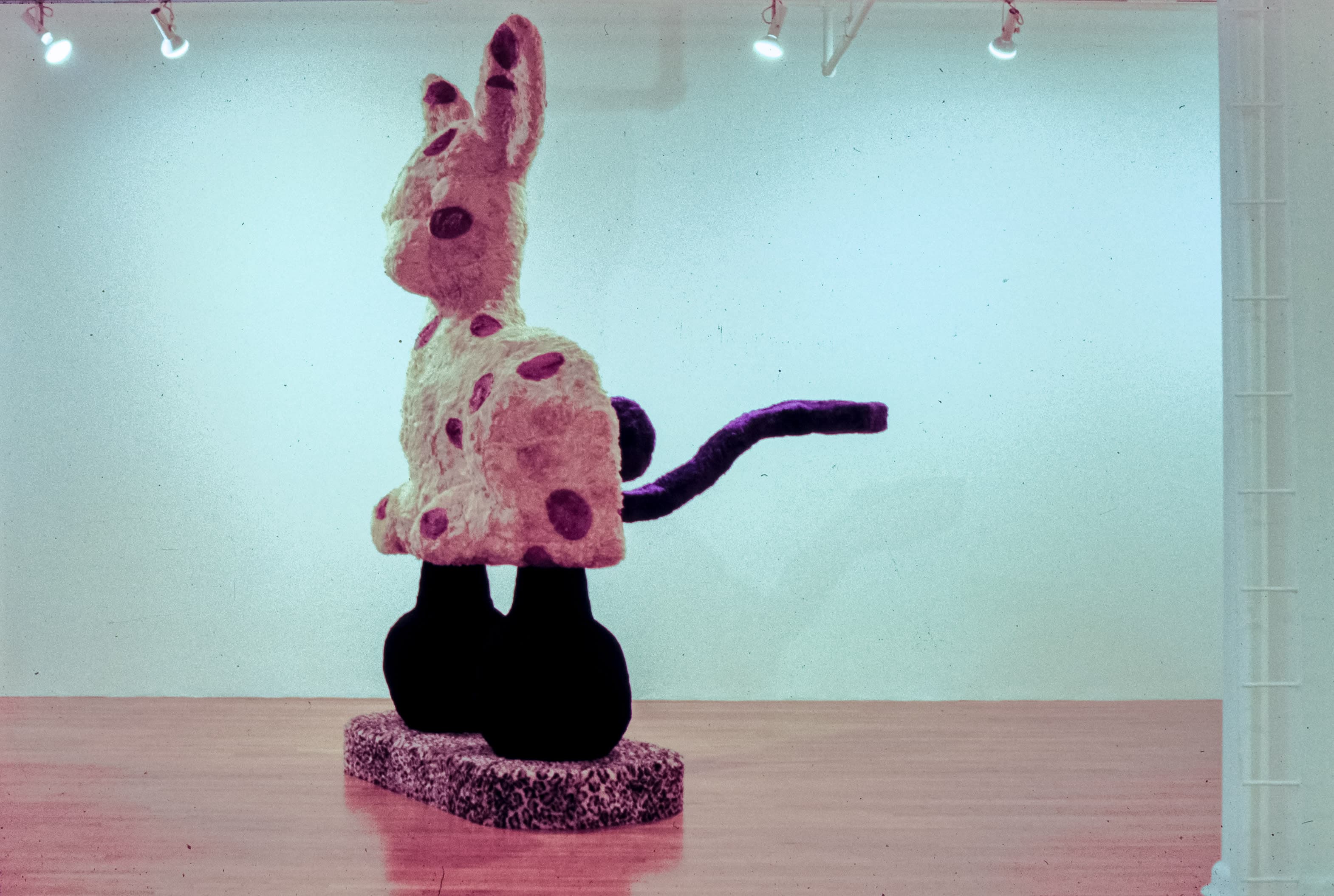 A giant Eric Bainbridge sculpture consisting of an oversized bambi with a hole and a handle covered in fake fur and paint