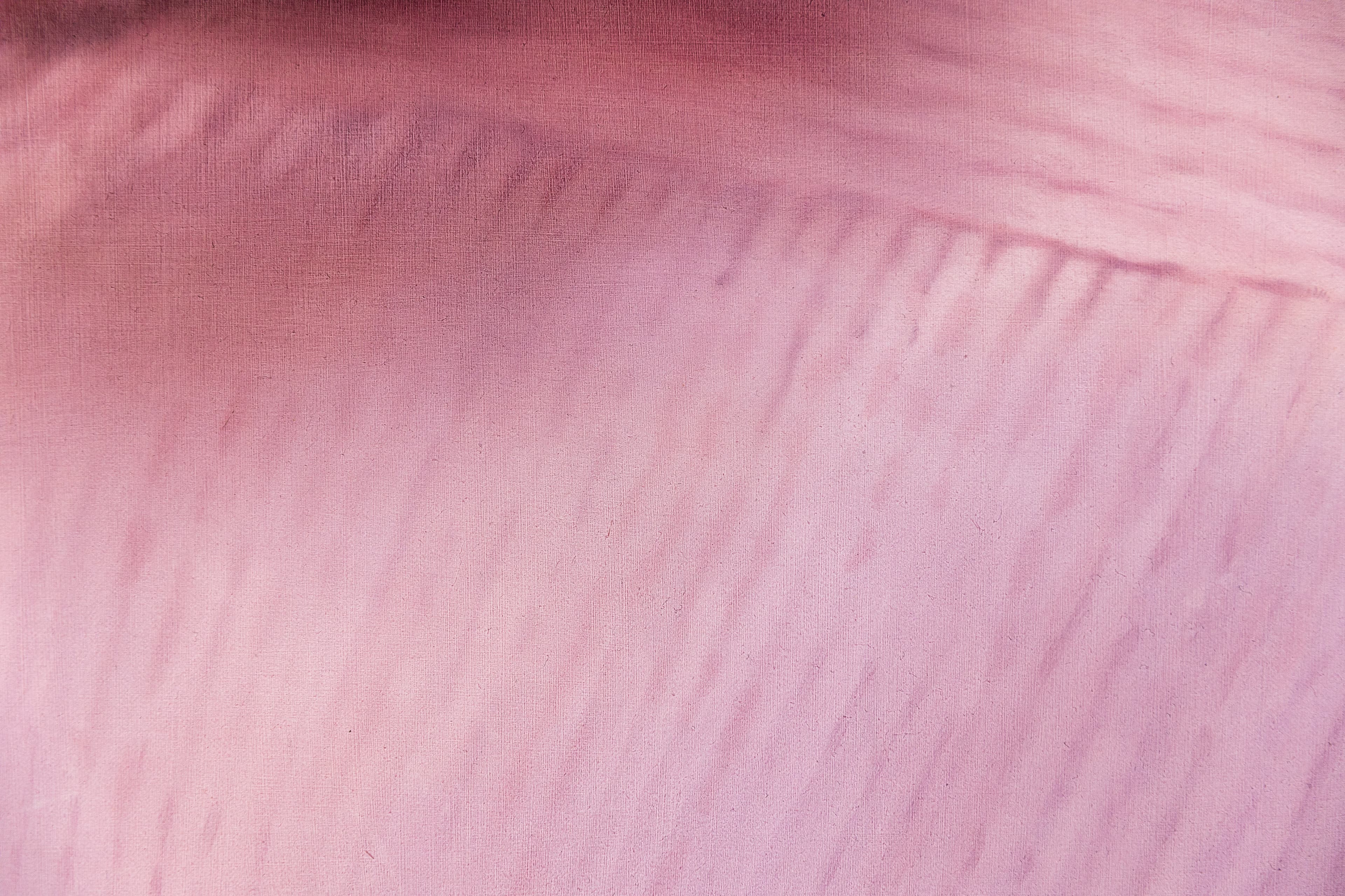 A painting of a shoulder and neck with a thin plait of hair over a pink jumper 