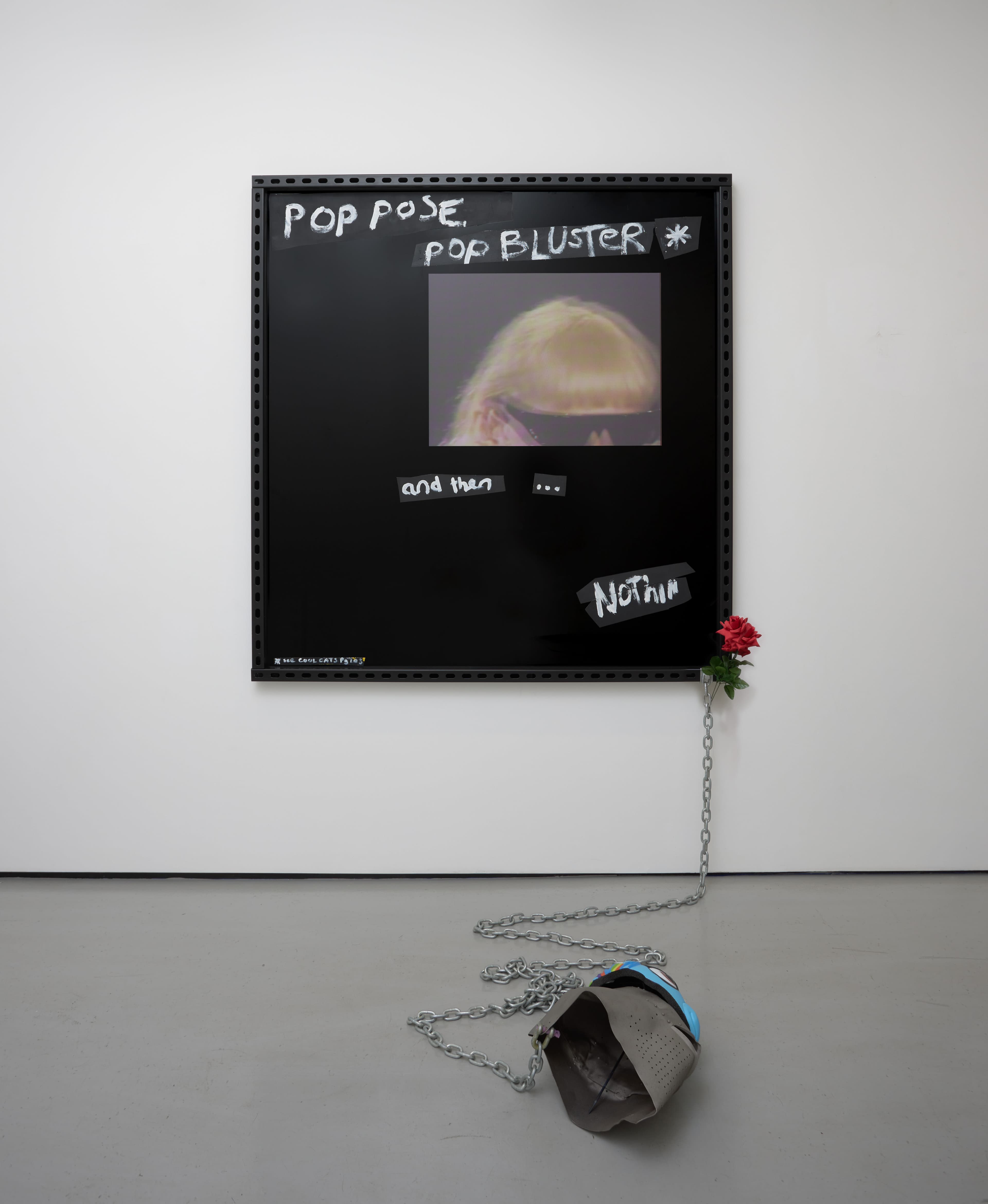 an image of Pop Pose, 2023 by Simeon Barclay, consisting of Black ACM board, vinyl, metal, oil and acrylic paint, chain, replica Great Helm, children’s unicorn bicycle helmet, acrylic on canvas, plastic rose