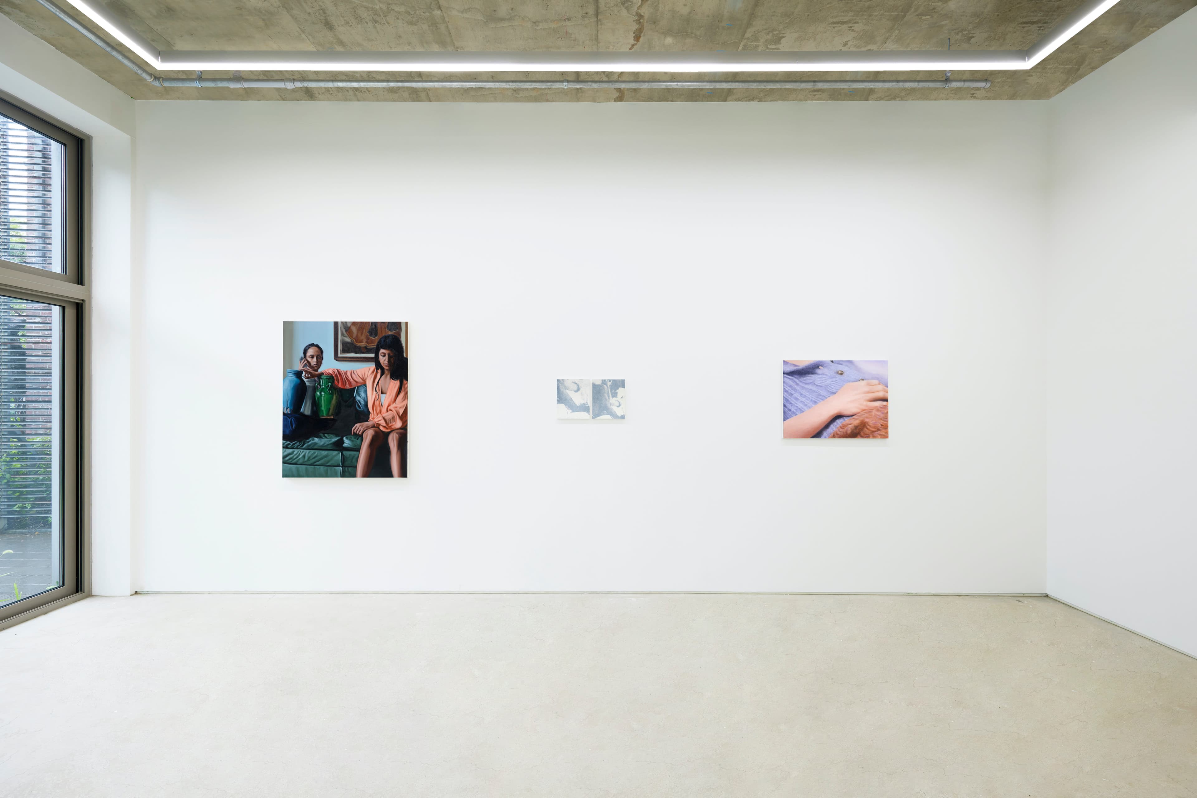 An installation view of a group painting exhibition including a painting by Rachel Lancaster