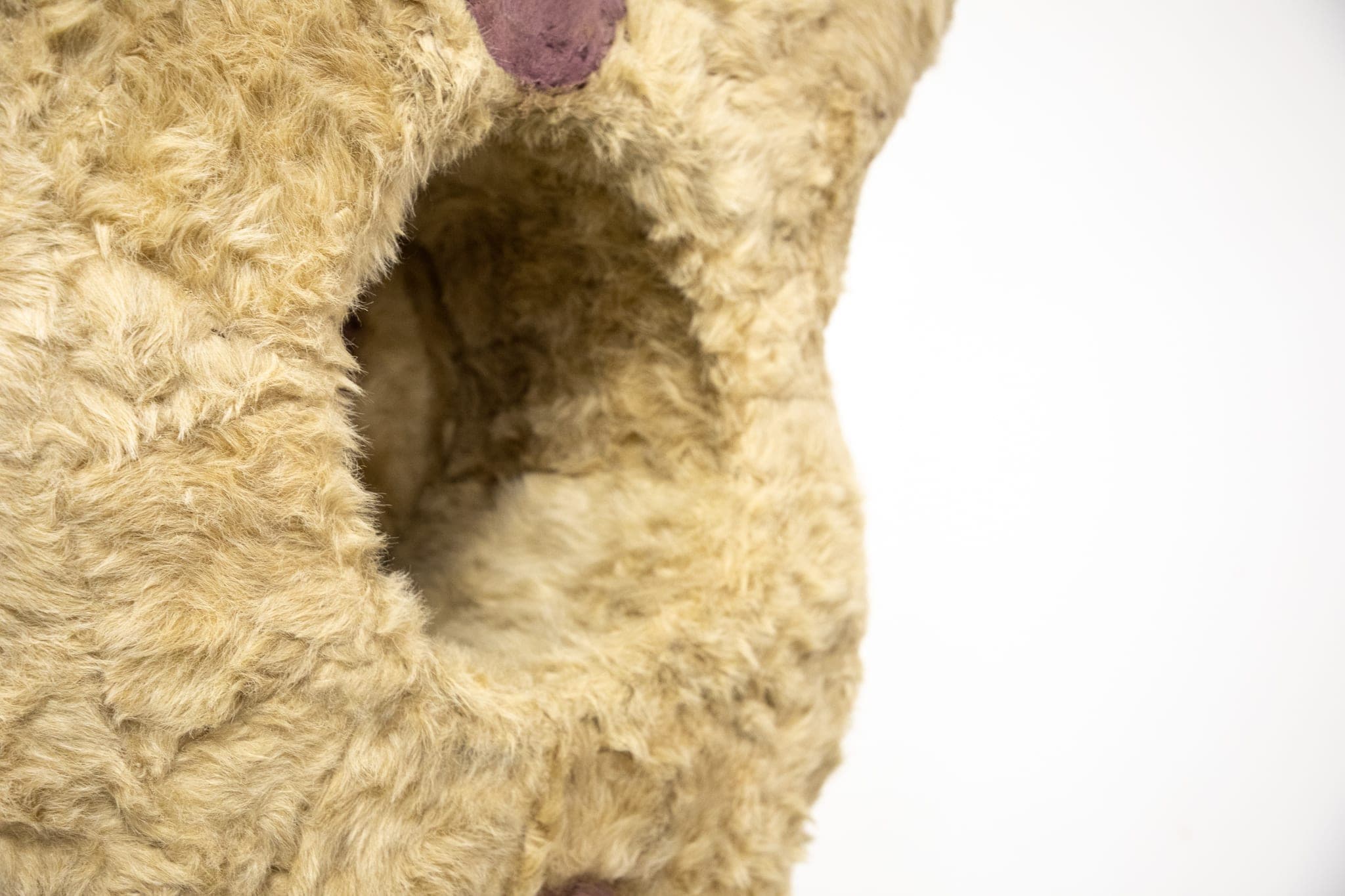 Details of a giant Eric Bainbridge sculpture consisting of an oversized bambi with a hole and a handle covered in fake fur and paint