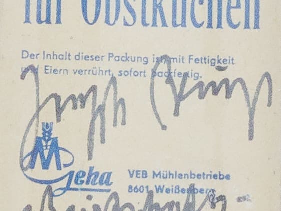 A cropped image of Joseph Beuys' signature on a bag of flour