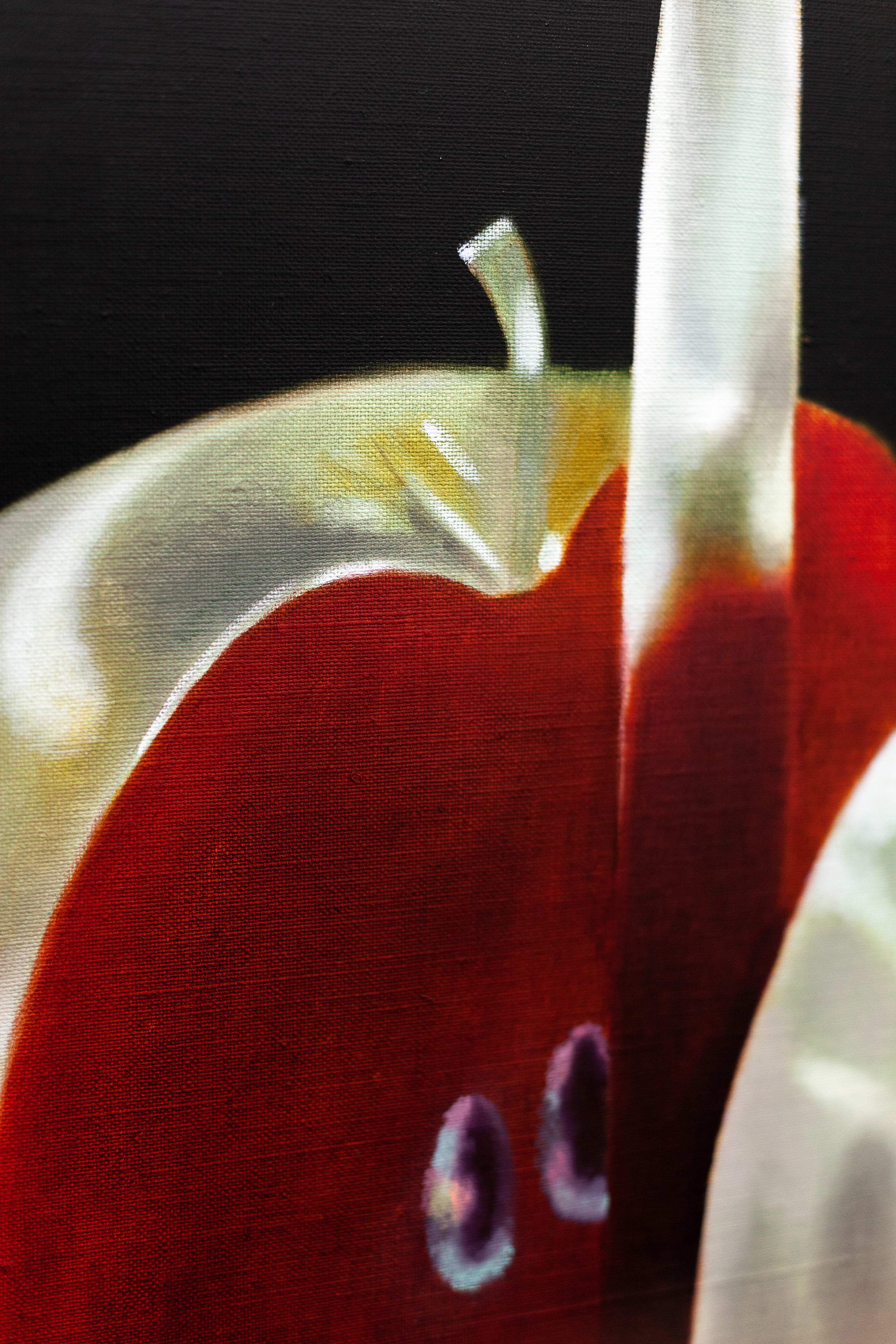 A painting by Robin Megannity of a silver metallic apple with a red core being cut half by a silver knife