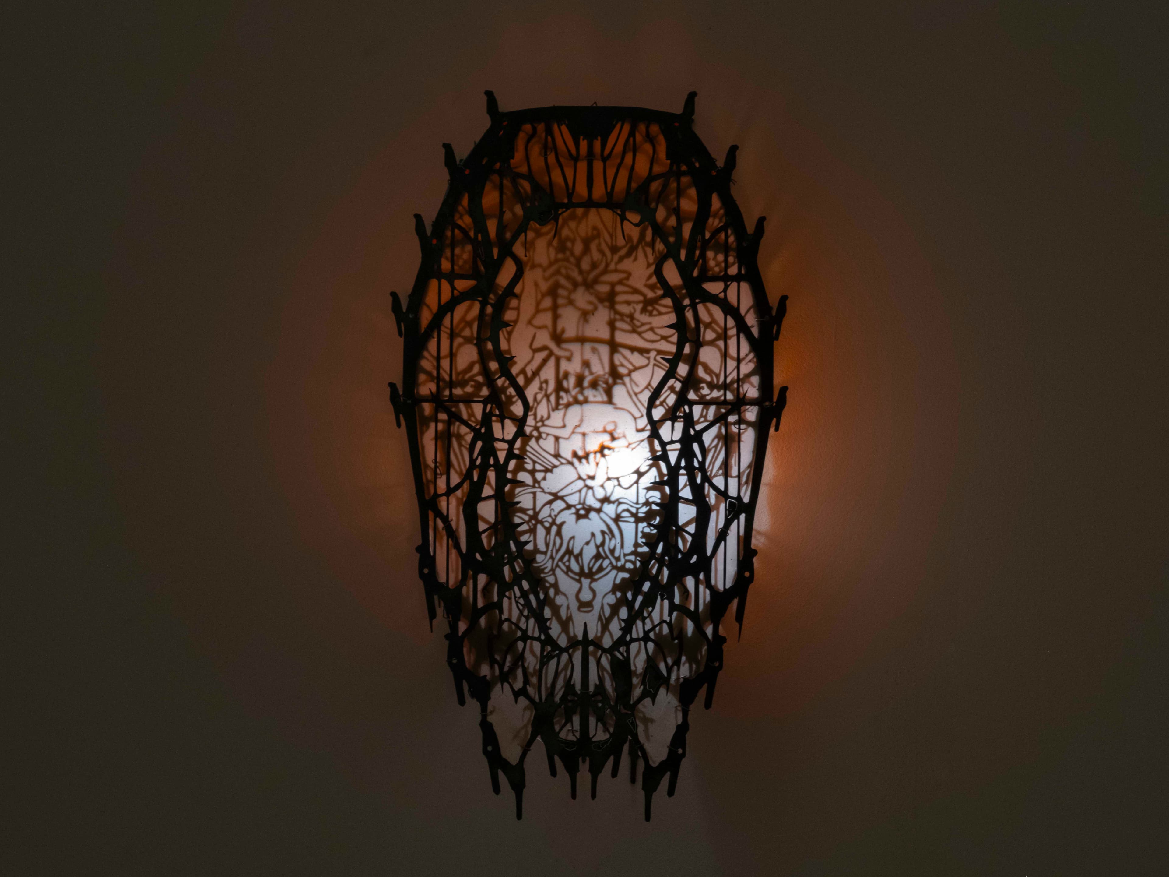 Wall sculpture by Hazel Brill made of a metal frame and latex skin and lit from the inside with a dim white light. Gothic in style.