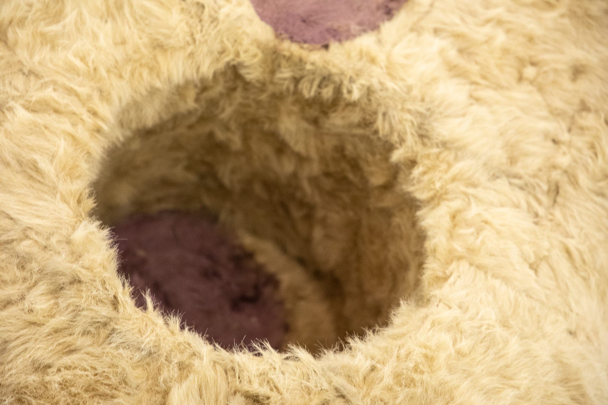 Details of a giant Eric Bainbridge sculpture consisting of an oversized bambi with a hole and a handle covered in fake fur and paint