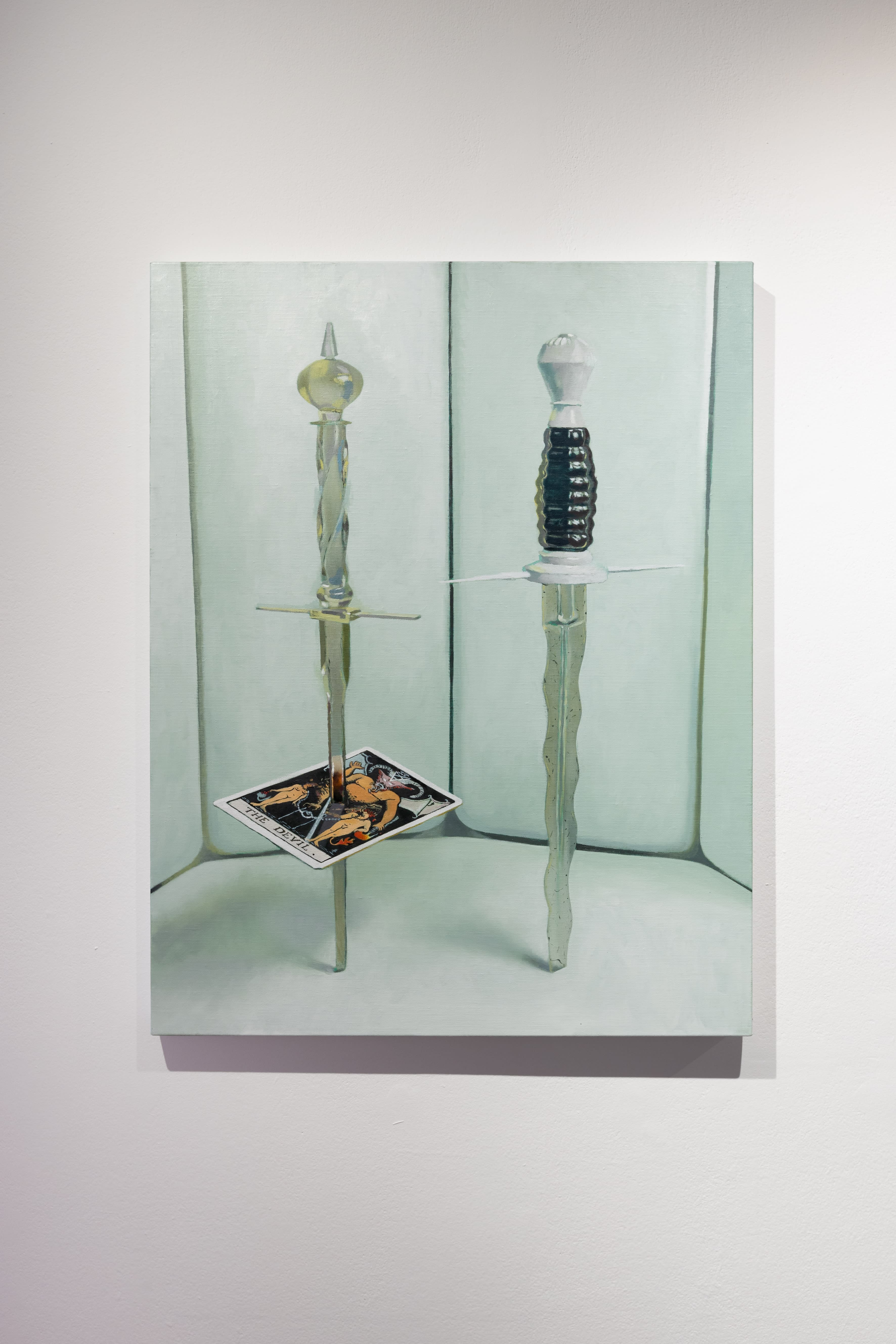 A painting by Robin Megannity of two decorative knives stood upright one impaling a playing card