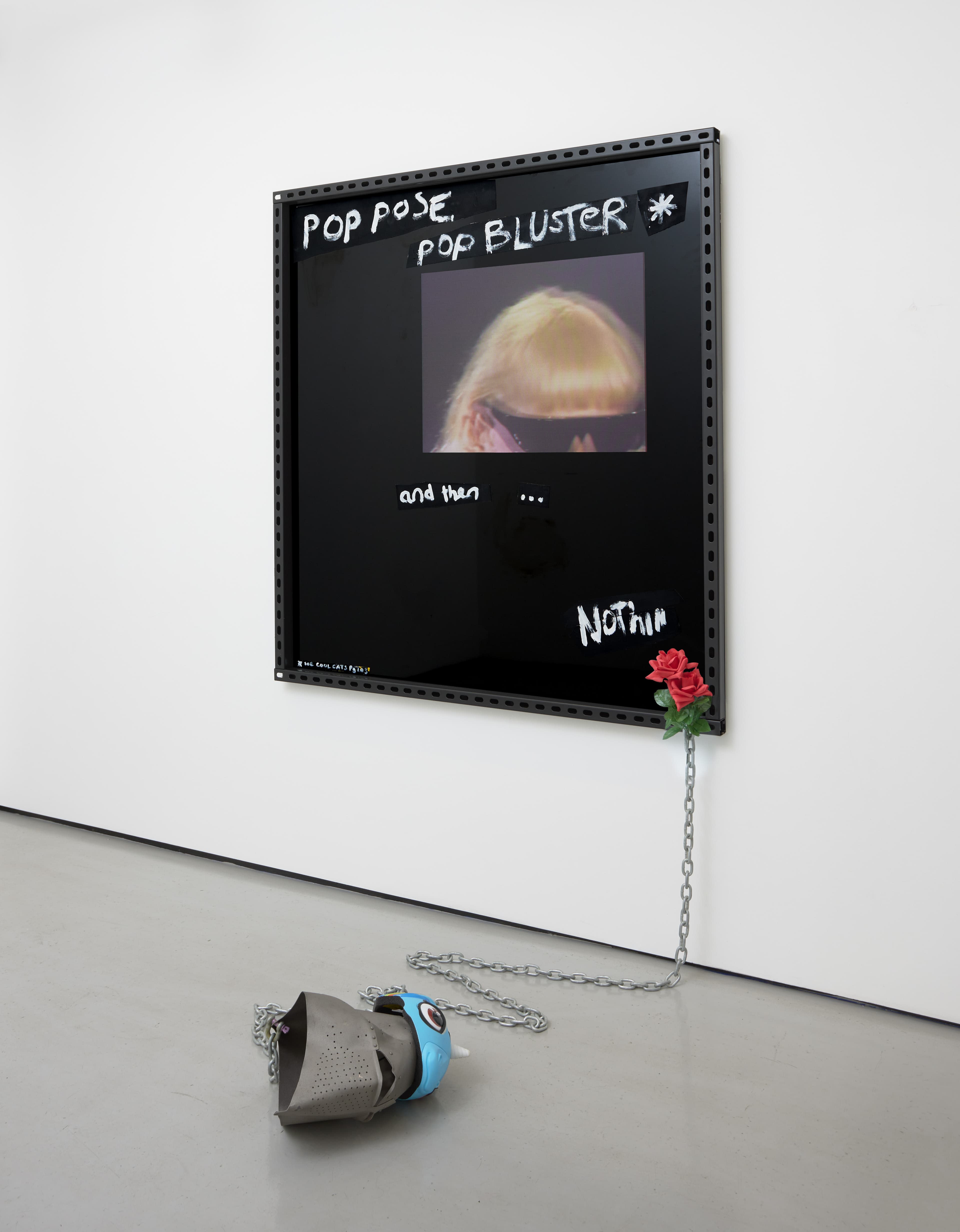 an image of Pop Pose, 2023 by Simeon Barclay, consisting of Black ACM board, vinyl, metal, oil and acrylic paint, chain, replica Great Helm, children’s unicorn bicycle helmet, acrylic on canvas, plastic rose