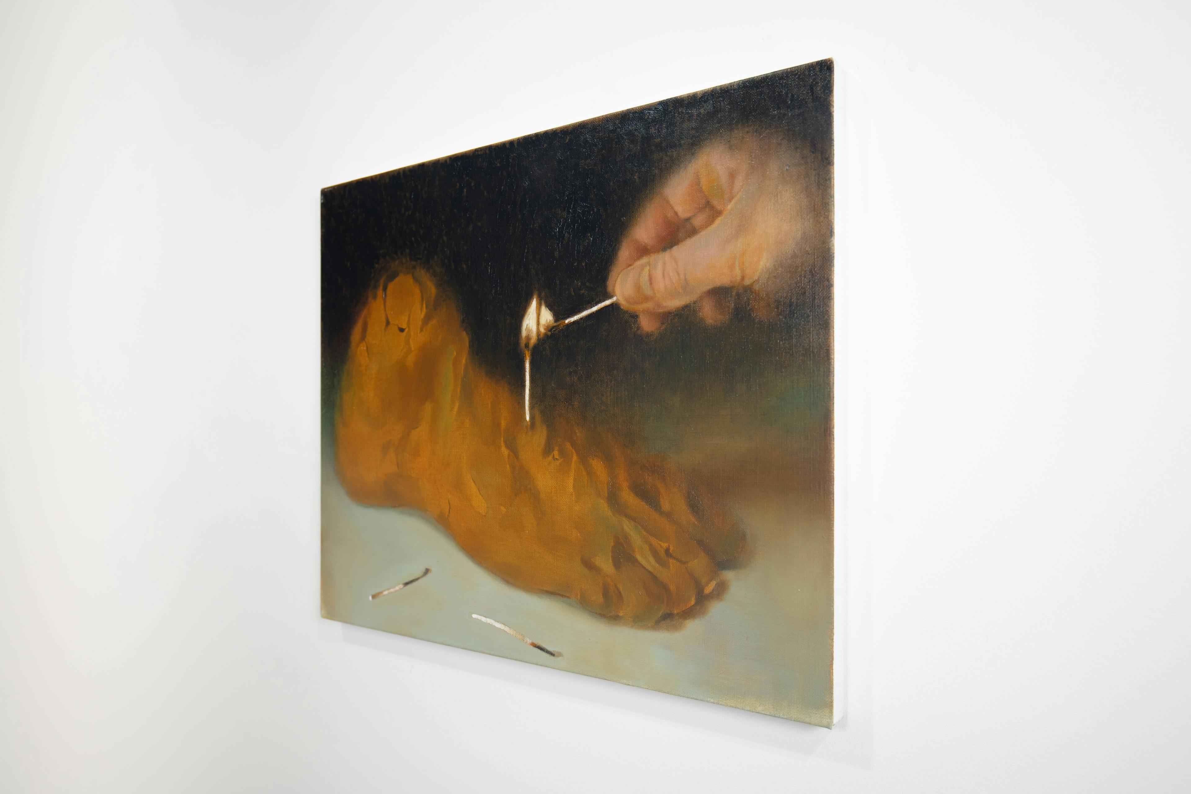 a painting of a hand lighting a match stuck in a clay sculpture of a foot with a match. 