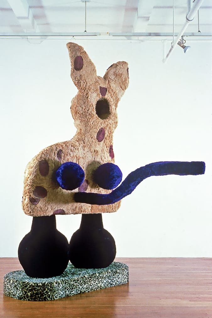 A giant Eric Bainbridge sculpture consisting of an oversized bambi with a hole and a handle covered in fake fur and paint