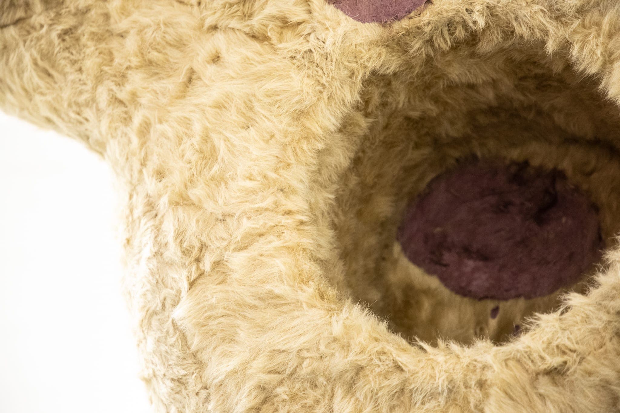 Details of a giant Eric Bainbridge sculpture consisting of an oversized bambi with a hole and a handle covered in fake fur and paint