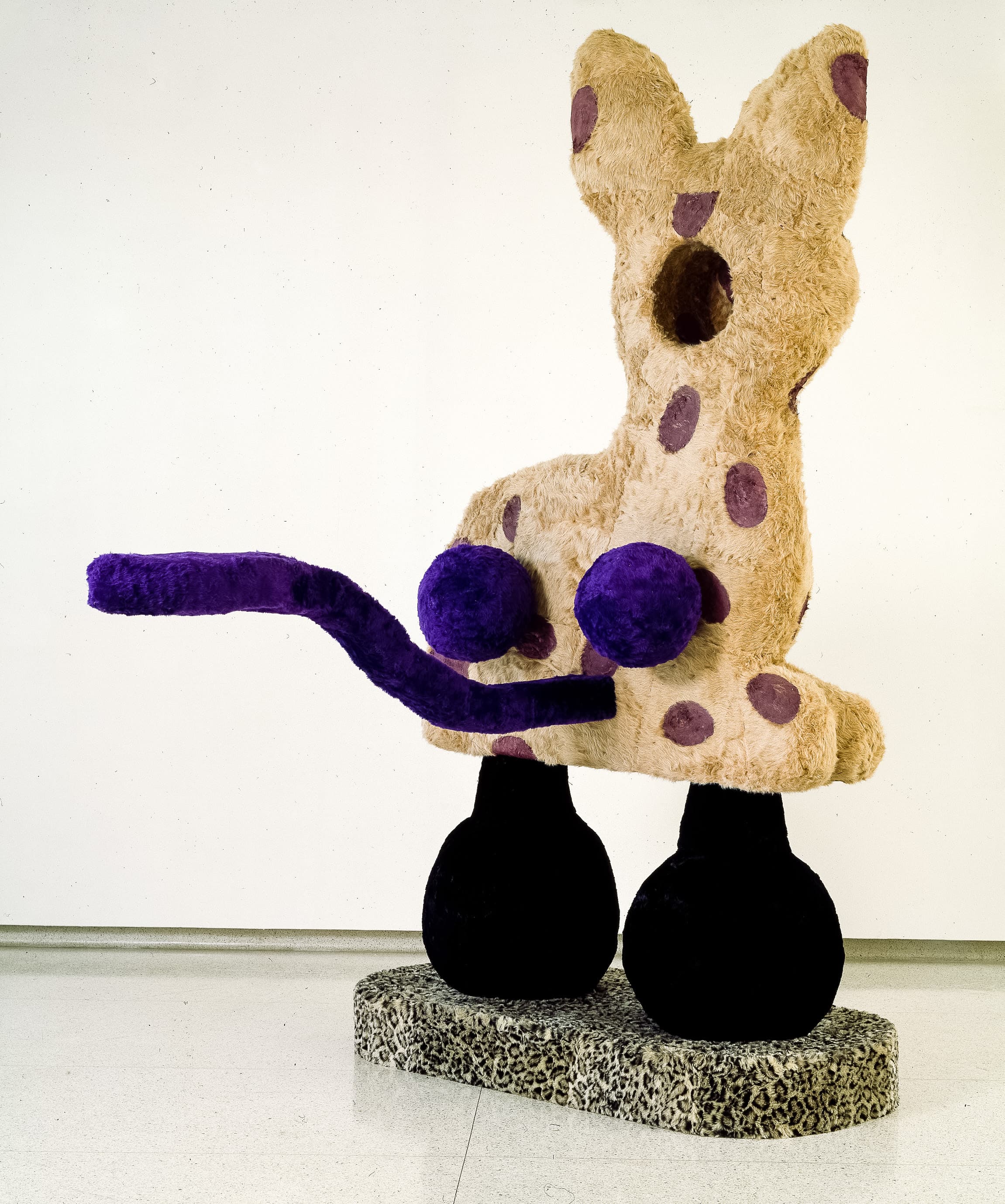 A giant Eric Bainbridge sculpture consisting of an oversized bambi with a hole and a handle covered in fake fur and paint