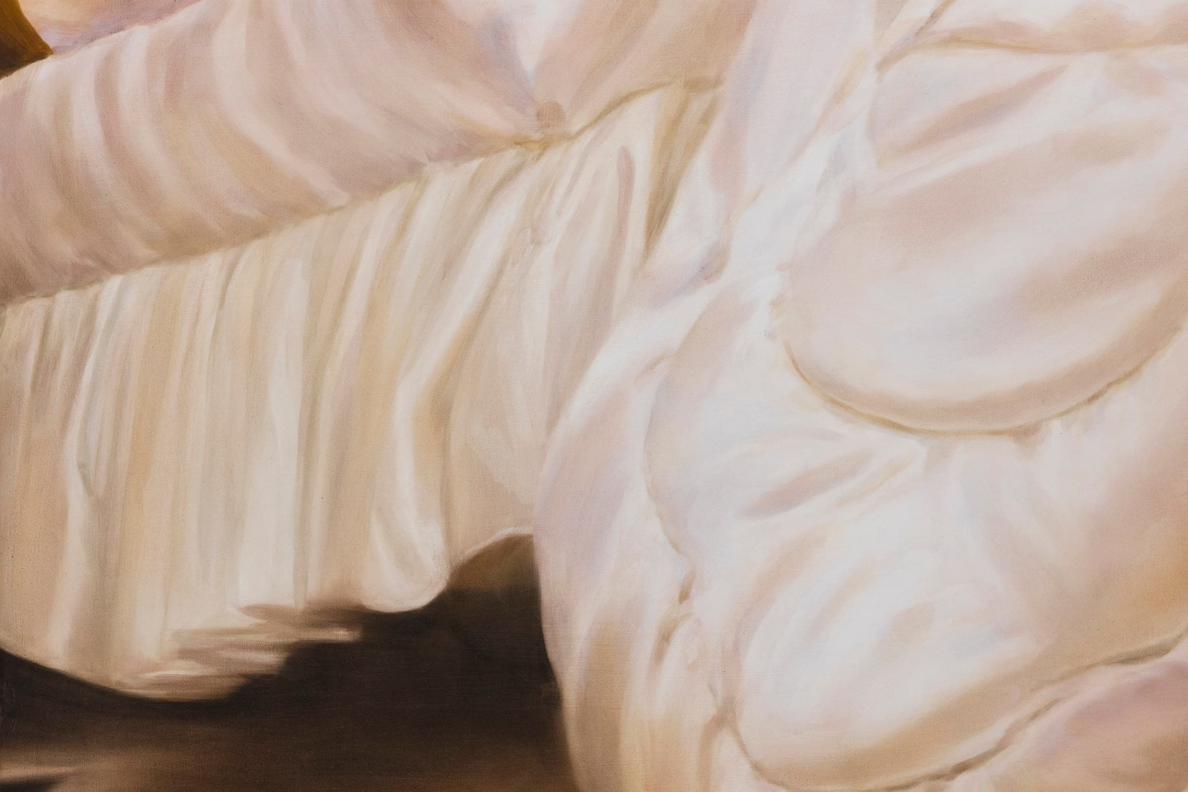 detail crop of a painting of an eiderdown touching the floor