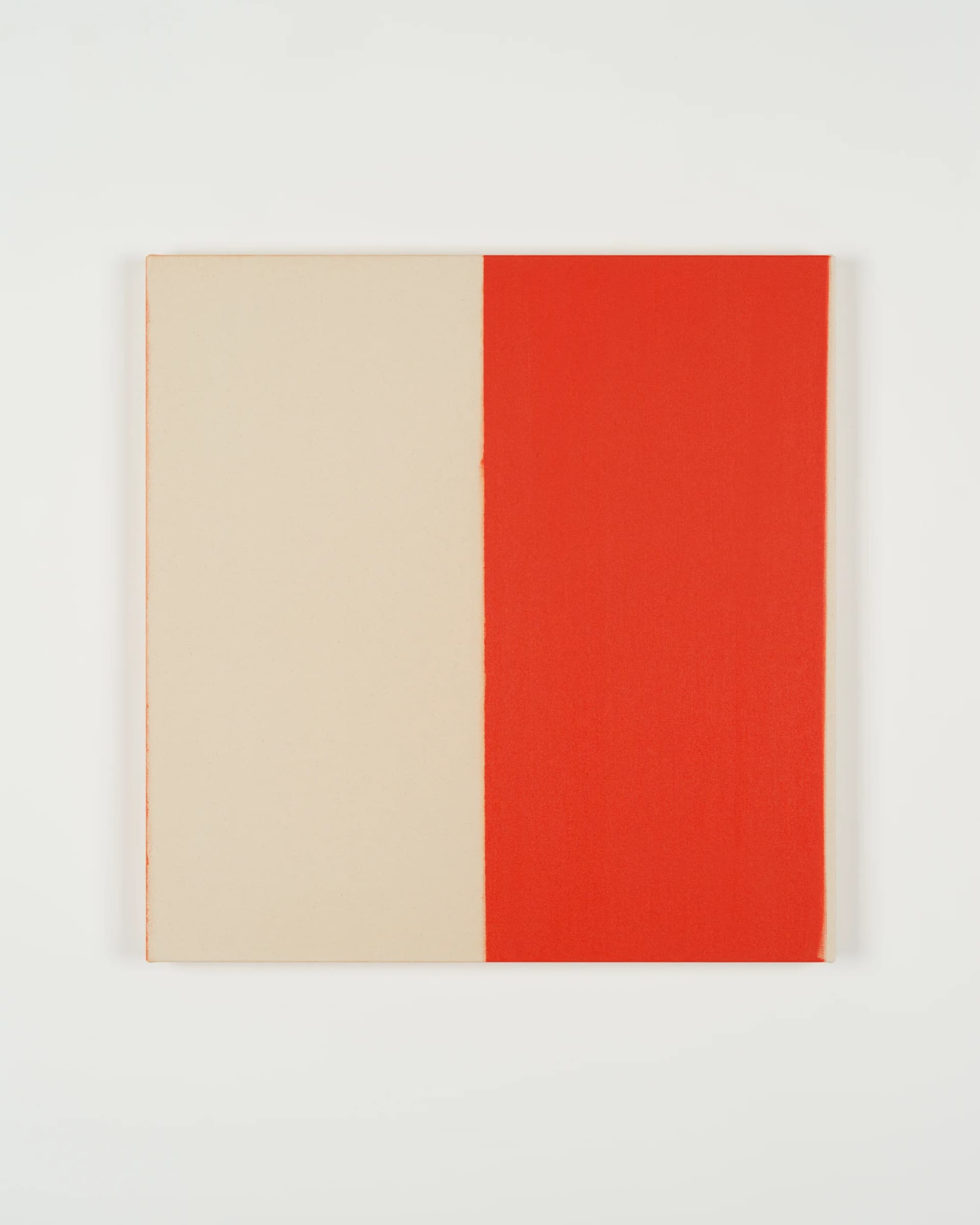Painting by Callum Innes, one side raw canvas, the other bright orange