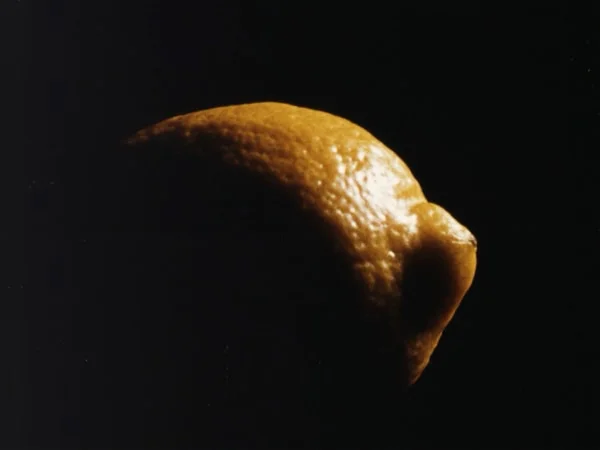 A lemon lit from one side