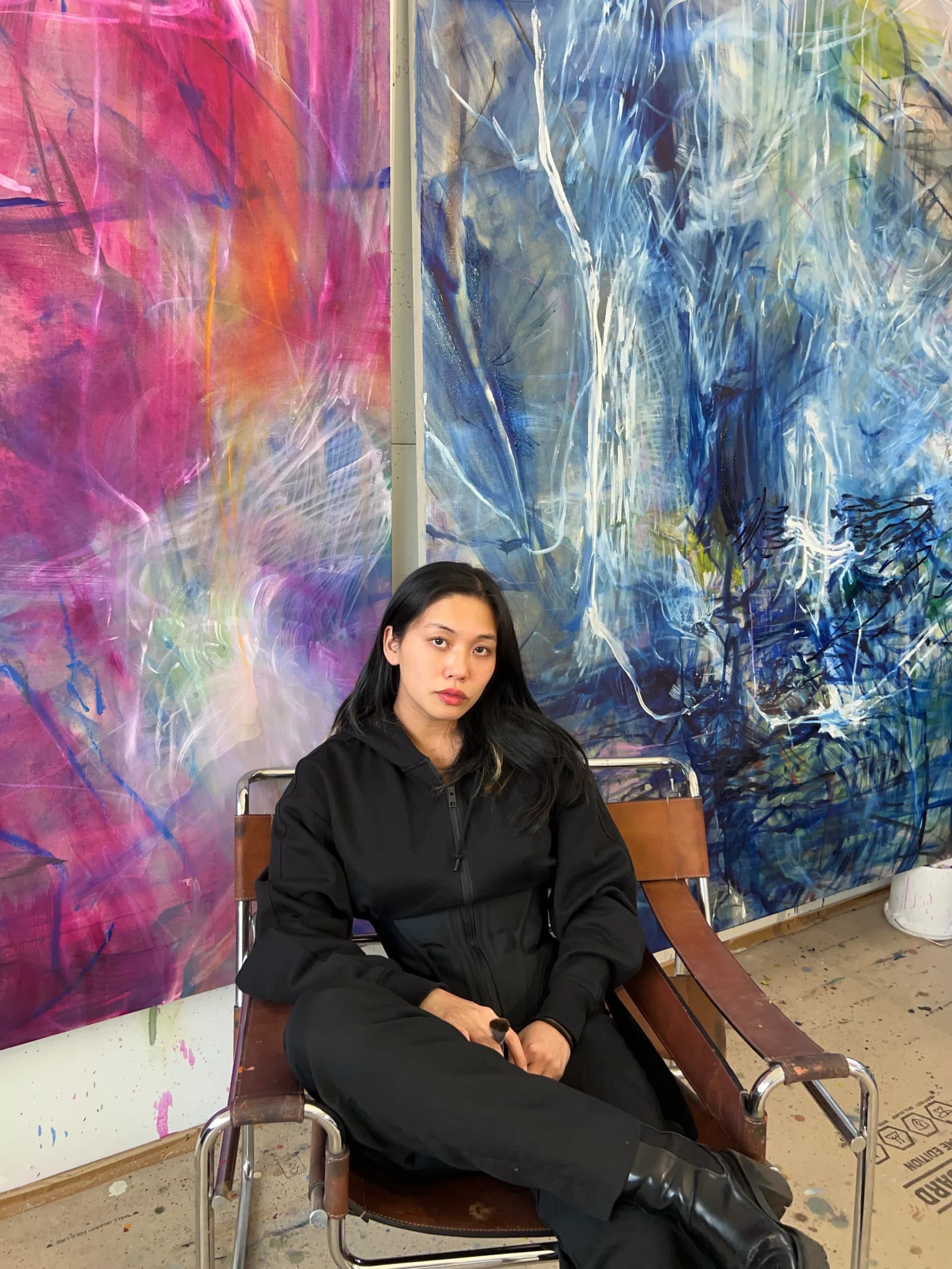 A portrait of Kristy M Chan sat in her studio