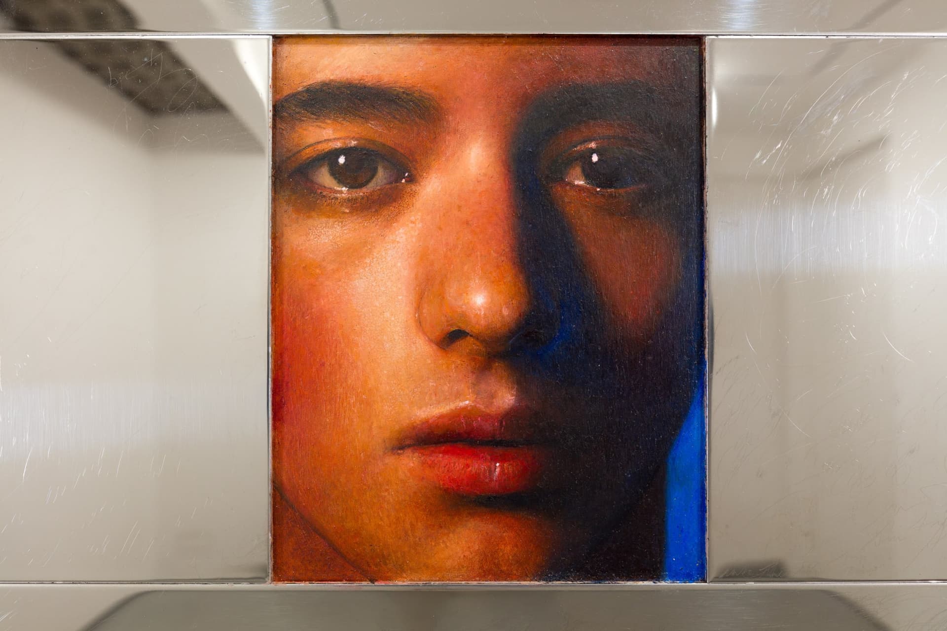 A detail of a painting by Ki Yoong in a reflective frame